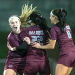 PHOTO BY FOREST WORGUM Montesanos Kennedy Campbell, left, and Adda Potts (8) celebrate a goal by Bethanie Henderson (22) during the Bulldogs victory over Bellevue Christian in a 1A State first-round game on Wednesday in Montesano.