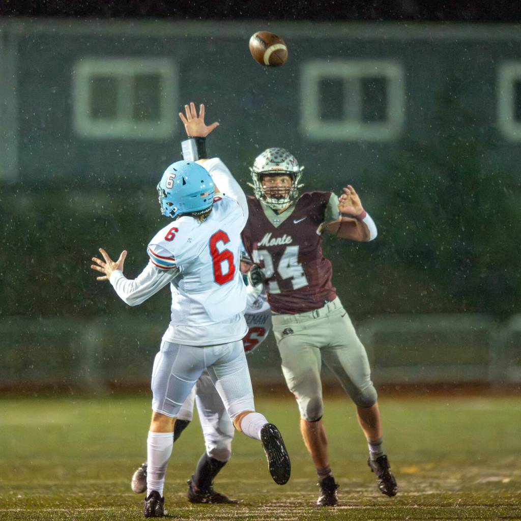 PHOTO BY FOREST WORGUM Montesano defender Tyler Johansen (24) pressures Freeman quarterback Logan Schultz during a 28-21 loss in a 1A State first-round playoff game on Friday in Montesano.
