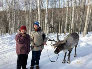 Provided photo
Dawn Keogh, center, stands with her friend Connie, left, and a reindeer at a Running Reindeer Ranch in Fairbanks, Alaska, in between her two cancer journeys. Keogh fought colon cancer during 2018 and 2019. Then in 2023, she was diagnosed with peritoneal cancer. On Sunday, Hoquiam Brewing Company and Mark Bowman will host a fundraiser for Keogh.
