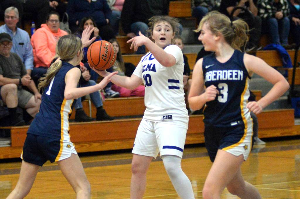 RYAN SPARKS | THE DAILY WORLD Elma senior point guard Emmie Spencer (10) directs traffic against Aberdeens Sophie Knutson (1) and Zoe Troeh (3) during a 44-34 loss to Aberdeen on Tuesday in Elma.