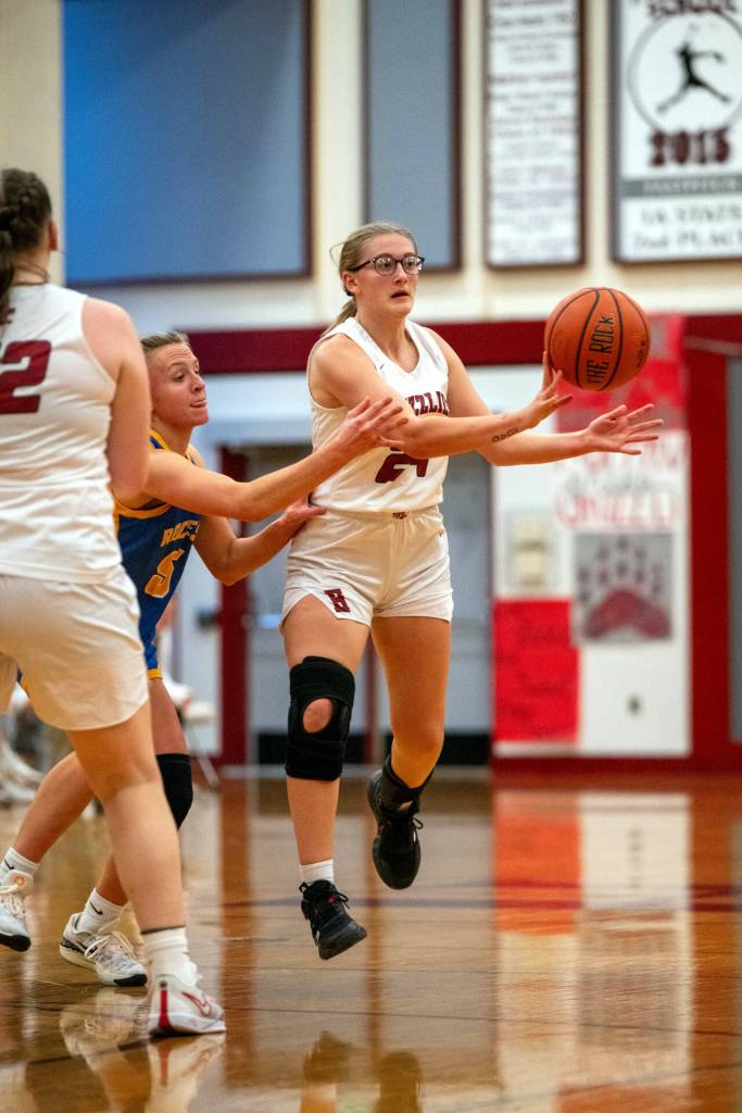 PHOTO BY FOREST WORGUM Hoquiams Nadine Stewart, right, passes the ball during a 45-18 season-opening loss on Tuesday at Hoquiam Square Garden.