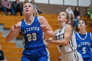 PHOTO BY FOREST WORGUM Monteasnos Lex Stanfield, right, looks to rebound against La Centers Mekenzie Schockelt during the Bulldogs 72-22 win on Thursday in Montesano.