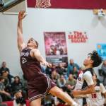 PHOTO BY FOREST WORGUM Montesano senior Tyce Peterson, left, scored in the paint during a 67-47 win over Raymond on Saturday at Raymond High School.