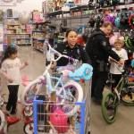 Michael S. Lockett / The Daily World
Law enforcement personnel and children buddied up for the annual Shop with a Cop event on Saturday.