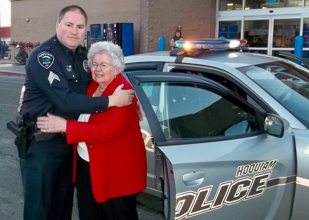 Courtesy photo / Cosmopolis Police Department
Sgt. Shane Krohn, who eventually ended up running the program, hugs Betty Crass, a civilian employee of the sheriffs office who started the Shop with a Cop program 25 years ago.