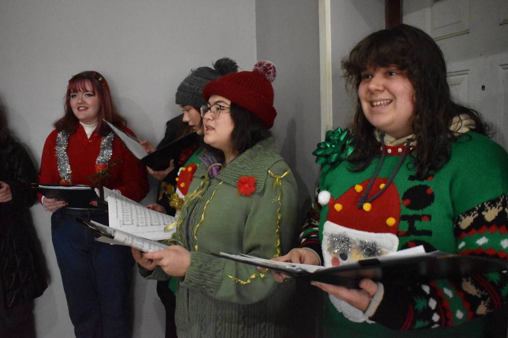 Matthew N. Wells / The Daily World
The Goldenaires from Aberdeen High School sang Christmas songs on Saturday afternoon near rows of well-crafted and creative gingerbread houses. From right, Madeline Casey, a junior; Judith Knight, a sophomore; Allie Olague, a sophomore; and Hannah Moline, a sophomore, sing.