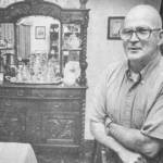 Kathy Quigg / The Daily World file photo
John Anderson, who passed away on Sept. 6, 2023, poses in 1981 with his oak dining room bureau, which his family acquired from the McCleary family, who founded the town in East County.