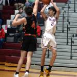 RYAN SPARKS | THE DAILY WORLD Montesano guard Delon Chan (21) puts up a jump shot against Centralias Aidan Haines during the Bulldogs 69-43 win on Tuesday in Montesano. Chan had 24 points to lead all scorers.