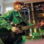 Matthew N. Wells / The Daily World
John Prentice III is a regular Open Mic Night performer at Messy Jessys Bar and Grill  212 S. I St., in Aberdeen. Prentice, who plays country covers and originals, is known for his stage presence and his ability to sound a bit like Johnny Cash. Prentice loves playing Cashs song, Ive Been Everywhere, because of its difficulty and how it pleases the crowd.