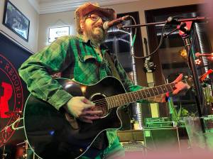 Matthew N. Wells / The Daily World
John Prentice III is a regular Open Mic Night performer at Messy Jessys Bar and Grill  212 S. I St., in Aberdeen. Prentice, who plays country covers and originals, is known for his stage presence and his ability to sound a bit like Johnny Cash. Prentice loves playing Cashs song, Ive Been Everywhere, because of its difficulty and how it pleases the crowd.