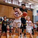 PHOTO BY FOREST WORGUM Hoquiam guard Lincoln Niemi, left, collides with North Beachs Tyrell Hovland during the Grizzlies 71-31 victory on Thursday at Hoquiam Square Garden.