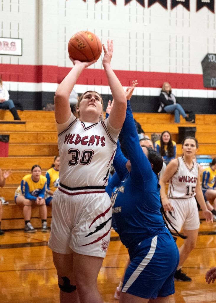 PHOTO BY VAN ADAM DAVIS Ocostas Alexia Bradley (30) scores from the low post during a 53-47 win over Chief Lecshi on Thursday in Westport.