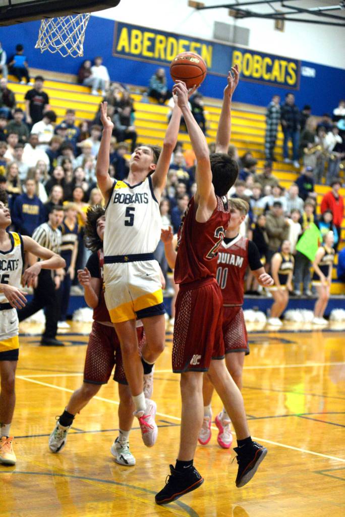 RYAN SPARKS | THE DAILY WORLD Aberdeen senior forward Baylor Ainsworth (5) drives to the rim during a 55-49 overtime win against Hoquiam on Monday in Aberdeen.