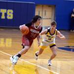 RYAN SPARKS | THE DAILY WORLD Aberdeen guard Grady Springer, right, defends against Hoquiam freshman Lincoln Niemi during the Bobcats 55-49 overtime win on Monday in Aberdeen.