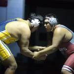 RYAN SPARKS | THE DAILY WORLD Aberdeens Paul Baltazar, left, and Hoquiams Omar Estrada grapple during a dual meet on Tuesday in Hoquiam.