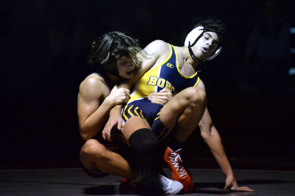 RYAN SPARKS | THE DAILY WORLD Hoquiams Kingston Case, left, wrestles with Aberdeens Adonis Hammonds during a dual meet on Tuesday in Hoquiam.