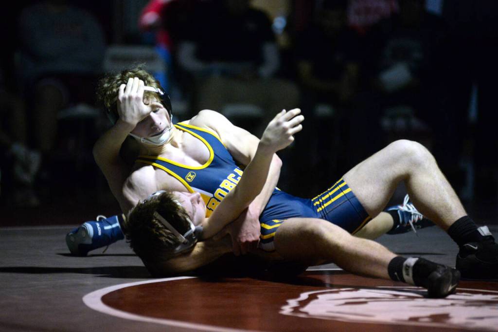 RYAN SPARKS | THE DAILY WORLD Aberdeens Michael Leontyev, top, works to pin Hoquiams Alfonso Fuentelsaz during a dual meet on Tuesday in Hoquiam.