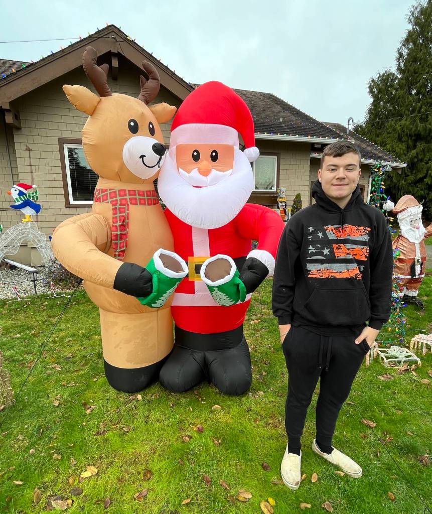 Matthew N. Wells / The Daily World
Put Bryson Walker on Santas nice list. Every year, just for the fun of it, Walker assembles an expansive Christmas light and decorative display at his familys home in Hoquiam  103 W. Eklund Ave. Clearly, Rudolph the Red Nosed Reindeer and Santa Claus approve as they clink their mugs full of hot cocoa.