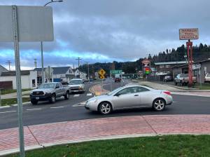 Traffic yields for a driver at the edge of the roundabout on Market Street in Aberdeen. The roundabout could get a facelift in 2024 after the city council approved Aberdeen's Parks and Recreation Director Stacie Barnum to apply for a $50,000 grant from Grays Harbor Community Foundation. While the overall council approved, not everyone was onboard as they cited concerns about safety for the drivers and the pedestrians who use the roundabout. (Matthew N. Wells / The Daily World)