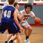 PHOTO BY FOREST WORGUM Hoquiam guard Lincoln Niemi (24) dribbles against Onalaska in an 86-44 win on Thursday in Hoquiam.