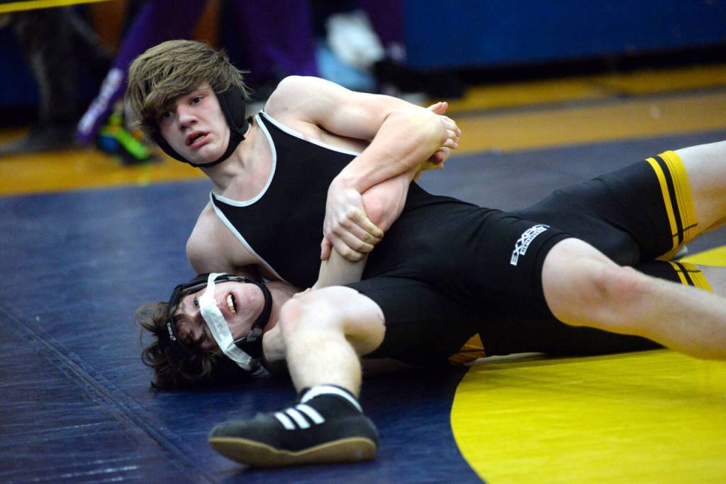 RYAN SPARKS / THE DAILY WORLD 
Willapa Harbors Kason Clements, top, controls Lincolns Corbin Patino during the 138-pound third-place match at the Grays Harbor Championship meet on Saturday at Aberdeen High School.