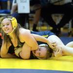 RYAN SPARKS | THE DAILY WORLD 
Aberdeens Felicia Bell, top, is all smiles as she works for a pin against Napavines Anna Guenther during the 120-pound final of the Grays Harbor Championship meet on Saturday in Aberdeen.