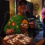 Clayton Franke / The Daily World
Matthew Wells, a reporter with The Daily World, receives a chocolate cake with #1 reporter Matt inscribed in white frosting.