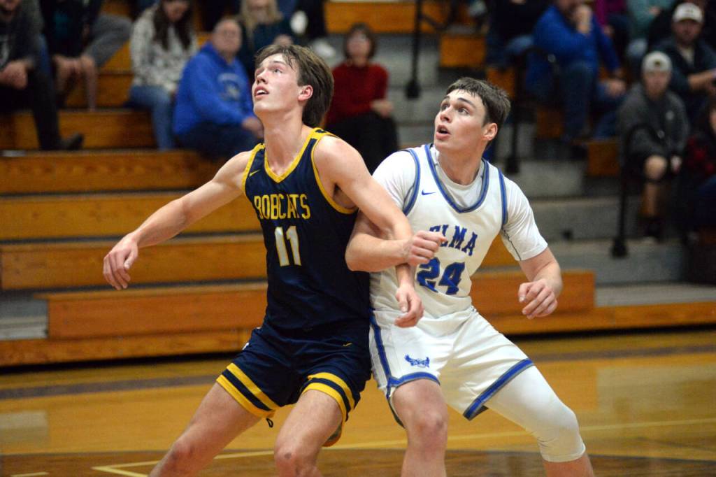 RYAN SPARKS | THE DAILY WORLD Aberdeens Charlie Ancich (11) and Elmas Carter Studer compete for a rebound during the Eagles 64-51 win over Aberdeen on Tuesday in Elma.