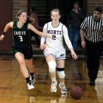 RYAN SPARKS | THE DAILY WORLD Montesano guard Tieander Olson (2) dribbles away from Klahowyas McKenna Sullivan (3) during the Bulldogs 70-27 victory on Wednesday at Montesano High School.