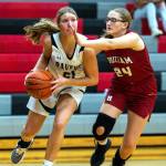 PHOTO BY FOREST WORGUM Raymond-South Bends Kassie Koski, left, drives against Hoquiams Nadine Stewart during the Ravens 49-17 win on Friday in Raymond.