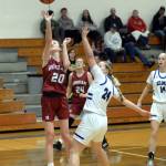 RYAN SPARKS | THE DAILY WORLD Hoquiams Hayden Brook-Andrew (20) scores against Elmas Amaya Lewis during the Grizzlies 46-30 loss on Wednesday in Elma.