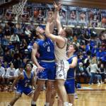RYAN SPARKS | THE DAILY WORLD Montesanos Tyce Peterson, right, puts up a shot against Elmas Traden Carter (0) during the Eagles 56-53 win on Tuesday in Montesano.