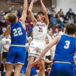 PHOTO BY FOREST WORGUM Montesanos Delon Chan (21) shots over Elmas Cason Seaberg (22) during a 56-53 loss on Tuesday in Montesano.