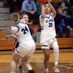 RYAN SPARKS | THE DAILY WORLD Elma senior Malia Sibbett (21) shoots around a screen from teammate Amaya Lewis (24) during the Eagles 49-21 win over Tenino on Thursday at Elma High School.