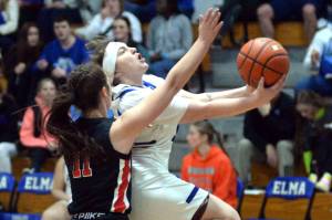 RYAN SPARKS | THE DAILY WORLD Elma senior guard Emmie Spencer, right, drives to the basket during the Eagles 49-21 win over Tenino on Thursday at Elma High School.