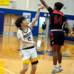 RYAN SPARKS | THE DAILY WORLD Aberdeens Manny Garcia (12) shoots a 3-pointer while defended by Raymonds Chris Quintana during the Bobcats 55-54 win on Saturday in Aberdeen.