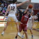 RYAN SPARKS | THE DAILY WORLD Hoquiam freshman Lincoln Niemi (24) passes against Montesanos Gabe Bodwell (12) during the Grizzlies 65-61 overtime win on Tuesday in Montesano.