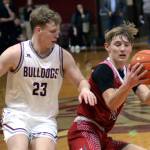 RYAN SPARKS | THE DAILY WORLD Hoquiams Zander Jump, right, is defended by Montesanos Tyce Peterson during the Grizzlies 65-61 overtime win on Tuesday in Montesano.