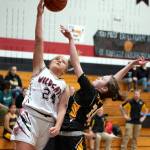 PHOTO BY VAN ADAM DAVIS Ocosta guard Bristol Towle (24) goes up for a shot against North Beachs Elka Cox during the Wildcats 62-30 on Wednesday in Westport.
