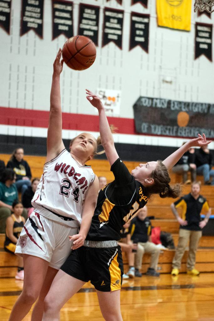 PHOTO BY VAN ADAM DAVIS Ocosta guard Bristol Towle (24) goes up for a shot against North Beachs Elka Cox during the Wildcats 62-30 on Wednesday in Westport.