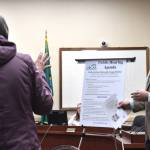 Montesano resident Donna Albert, left, talks with Dan Nelson, communications manager with the Olympic Regional Clean Air Agency, at a Jan. 16 public hearing at Hoquiam City Hall regarding a proposed wood pellet plant in Hoquiam.