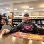 Matthew N. Wells / The Daily World
Thomas Hedlund, one of the owners of Game Freaks Aberdeen, sits at one of the gamer tables inside his shop at 121 W. Wishkah St. The shop will move up the street to 108 E. Wishkah St. The move will allow much more space for gaming, a dedicated Dungeons & Dragons room, and other improvements gamers will notice.