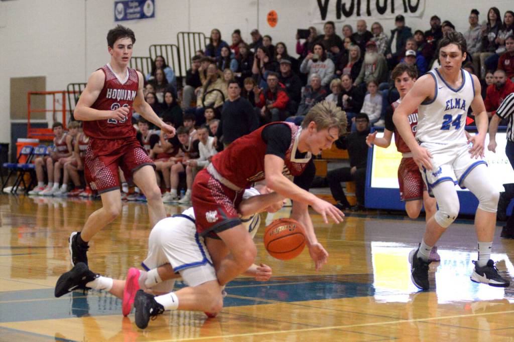 RYAN SPARKS | THE DAILY WORLD Hoquiams Zander Jump gets tangled up with Elmas Grant Vessey while going for a loose ball during the Eagles 60-49 win on Thursday at Elma High School.