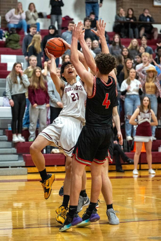 PHOTO BY FOREST WORGUM Montesanos Delon Chan (21) is fouled late in the fourth quarter of the Bulldogs 55-53 win over Tenino on Thursday in Montesano. Chan would sink two free throws to secure the victory.