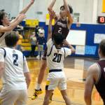 RYAN SPARKS | THE DAILY WORLD Montesanos Delon Chan (21) rises up for a jump shot while defended by Aberdeens Xanto Raya (20) during the Bulldogs 52-38 win on Saturday at Aberdeen High School.