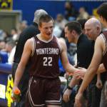 RYAN SPARKS | THE DAILY WORLD Montesanos Peyton Damasiewicz (22) is congratulated by his teammates after scoring 11 points and sparking a Bulldogs second-half run in a 52-38 win over Aberdeen on Saturday in Aberdeen.