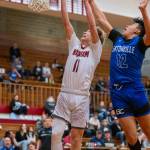 PHOTO BY FOREST WORGUM Hoquiams Zander Jump (11) glides to the basket while defended by Eatonvilles Hunter Klumpar during the Grizzlies 79-44 win on Saturday at Hoquiam Square Garden.