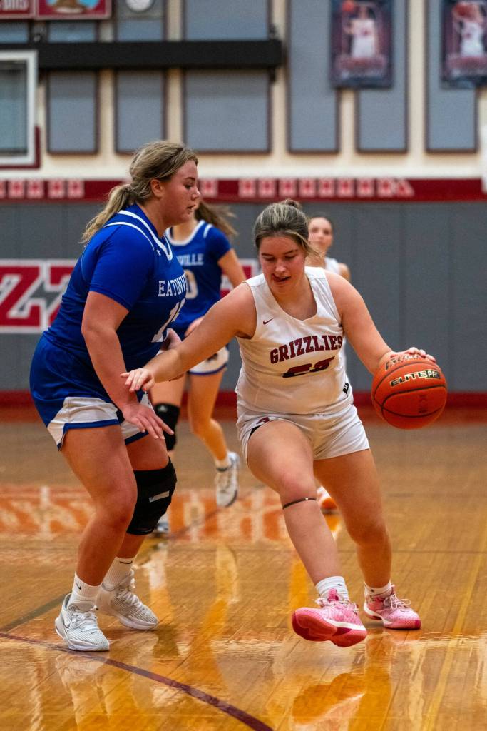 PHOTO BY FOREST WORGUM Hoquiams Avery Howard, right, dribbles against Eatonvilles Sara Smith during the Grizzlies 60-16 loss on Saturday at Hoquiam Square Garden.