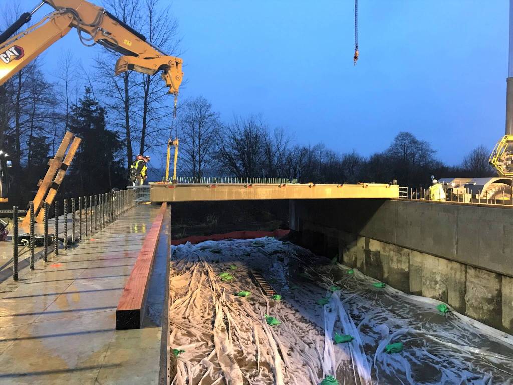 Courtesy photo / WSDOT
Crews working for WSDOT use heavy equipment to place concrete girders. Workers later will rebuild and restore the creek to benefit fish.