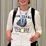 SUBMITTED PHOTO Montesanos Kya Roundtree is all smiles after placing first at the Queen of the Mountain invitational on Saturday in Auburn.